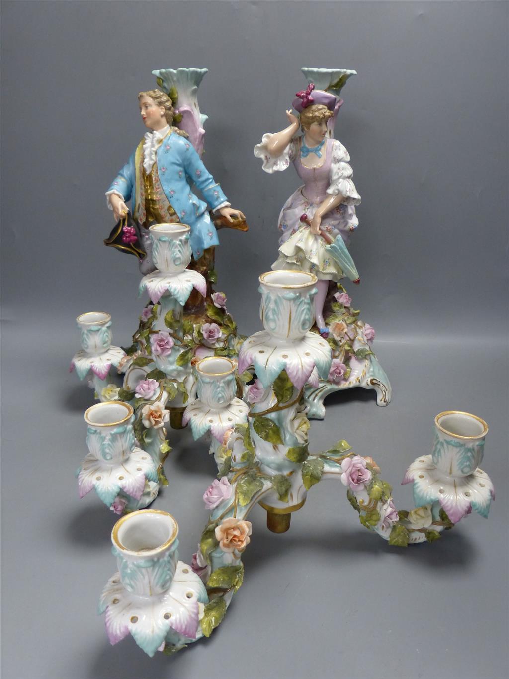 A pair of early 20th century Plaue porcelain figural candelabra, overall height 48cm